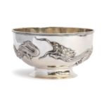 A Chinese silver rose bowl, encircled by two chased dragons in relief, on a circular spreading foot,