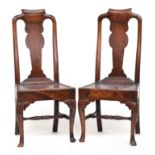 A pair of provincial Georgian oak splat black chairs, scrolled top rail with solid seat on