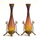 A pair of Jugendstil glass and brass vases, purple and ochre graduating glass, with scrolling enamel