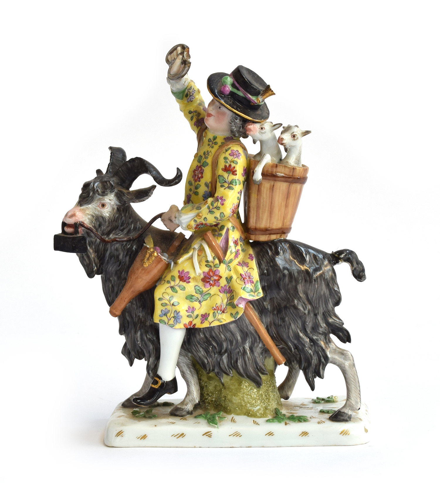 A 19th century Meissen porcelain figure of Count Bruhl's Tailor astride a goat, Meissen crossed