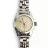 A Rolex Oyster ladies stainless steel wrist watch, the dial with baton markers on quarters, screw