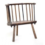 An 18th century provincial 'cut down' comb back chair, possibly Welsh, the back having four iron