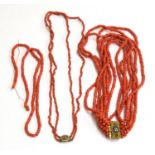 Two coral necklaces, one multi strand with ornate yellow metal and mosaic clasp, the other with a