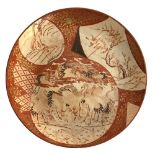 A large Japanese Meiji period satsuma plate, decorated with three shaped panels depicting cranes,