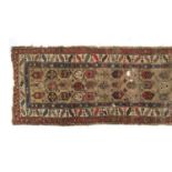 A Kuba long rug, late 19th century, bokeh ground within a triple border, 360x115cm