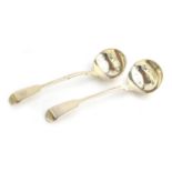 A near pair of Victorian silver fiddle pattern sauce ladles, one by Henry Holland, London 1859,