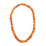 An amber necklace (approx 169g) purchased in Jerusalem 1918, beads approx 2.5cm x 1.75cm with