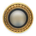 A Regency giltwood and gesso convex circular mirror with bobble moulding, 51cm diameter