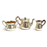 A Victorian silver three piece teaset by John Samuel Hunt, London 1864, with engraved decoration,