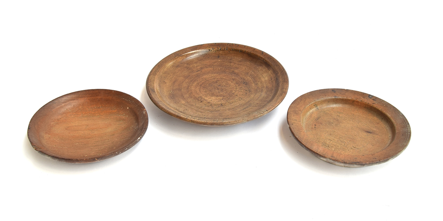 Three 18th century turned fruitwood bowls, 28cm, 23cm and 21.5cm diameter