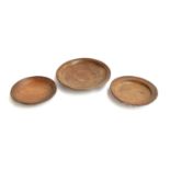 Three 18th century turned fruitwood bowls, 28cm, 23cm and 21.5cm diameter