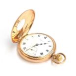 A Swiss made 9ct gold half hunter pocket watch, the white enamel dial marked Federal, with Roman