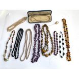 A quantity of costume jewellery to include hardstone necklaces, amethyst necklace etc; together with