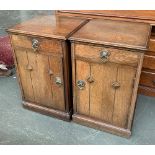 A pair of oak Arts and Crafts bedside tables, each single drawer over a cupboard door, 39x38x62cm