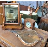 A small 19th century mahogany adjustable dressing mirror; together with an oak mantel clock, and a