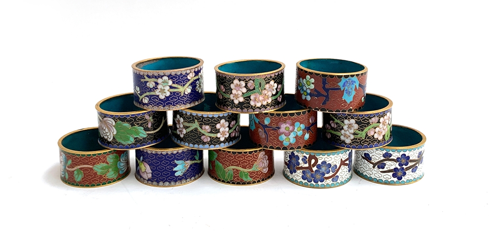 A lot of 12 cloisonne napkin rings with floral designs