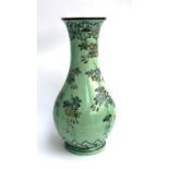 A large Chinese fahua baluster vase, green glaze with floral tube lined decoration, 63cm high