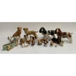 A collection of dog figurines, to include a Beswick corgi and others
