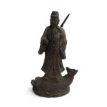 A bronze statue of a Chinese warrior standing upon a fish base, 34cmH