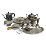 A mixed lot of plated items to include several teapots, a pair of small candlesticks, pair of