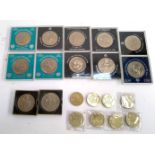 A collection of 12 cased commemorative coins; together with eight £2 coins, commemorating the 1986