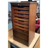 An Abbess mid century filing cabinet, with lockable tambour front, opening to reveal nine shallow