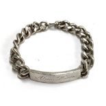 A silver curb link bracelet, the plaque engraved 'Alain-Pierre', marked B&S, Birmingham, 1974,