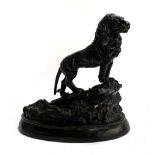 A bronze figure of a lion, 36cmH, 38cmL