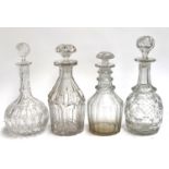 Four heavy cut glass decanters