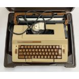 A Smith Corona Enterprise typewriter, in hard plastic case