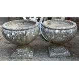 A pair of composite stone garden urns, 37cmD 34cmH