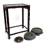 A Chinese hardwood table, 55cmH; together with two carved hardwood bowl stands (af) and one other