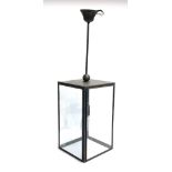 A Tekna Ilforf Closed Top rectangular metal and glass lantern, the lantern 43cmH, 82cmH to top of