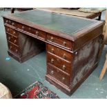 An early 20th century mahogany kneehole desk, tooled green leather skiver over traditional