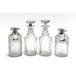 A small near pair of decanters; together with a further pair (af), each with silver decanter