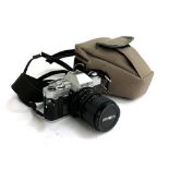 A Minolta X300 35mm camera, with lens and carry case