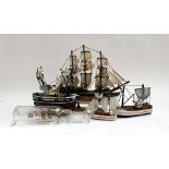 Four small model ships, the largest 32cmH; together with a blown glass ship in a bottle
