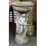 A composite stone birdbath, supported by the three Graces, 87cmH