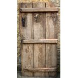 A three plank elm door with hardware, 175x87cm