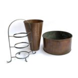 A conical copper vase, 33cmH; together with a copper planter, 33cmD; together with a tiered stand