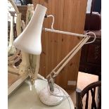 A white anglepoise lamp