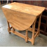 A small elm oval gateleg table, 76cmW