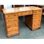 A 19th century satinwood pedestal desk by Heal & Son London, inverted break front over nine drawers,