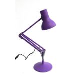 A modern purple anglepoise lamp