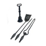 A cast iron doorstop together with a quantity of wrought iron fire tools