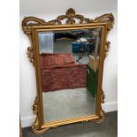 A 20th century wall mirror, with bevelled glass and acanthus frame, 95x60cm