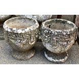 A pair of small composite stone planters, each 26cmH