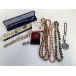 A mixed lot of costume jewellery to include necklaces, one with 925 silver pendant bail; together