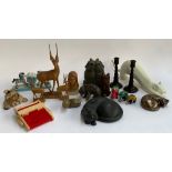 A mixed lot to include carved wooden animals; zebra bookends; wooden candlesticks; cat figures etc