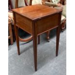 A mahogany sewing box, hinged lid revealing a green silk upholstered fitted interior, on square